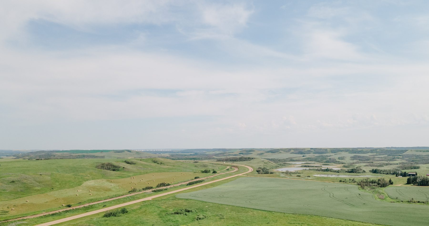 Aerial view of a lake and countryside in Alberta